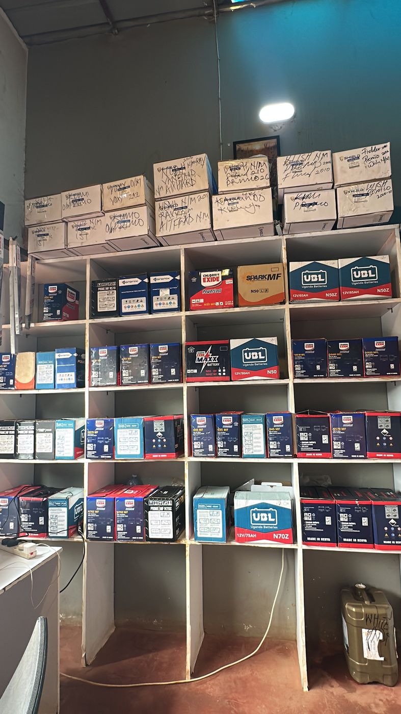 Shelves of UBL, Chloride Exide, Coronix and Shield car batteries in stock at Makanga Auto Centre