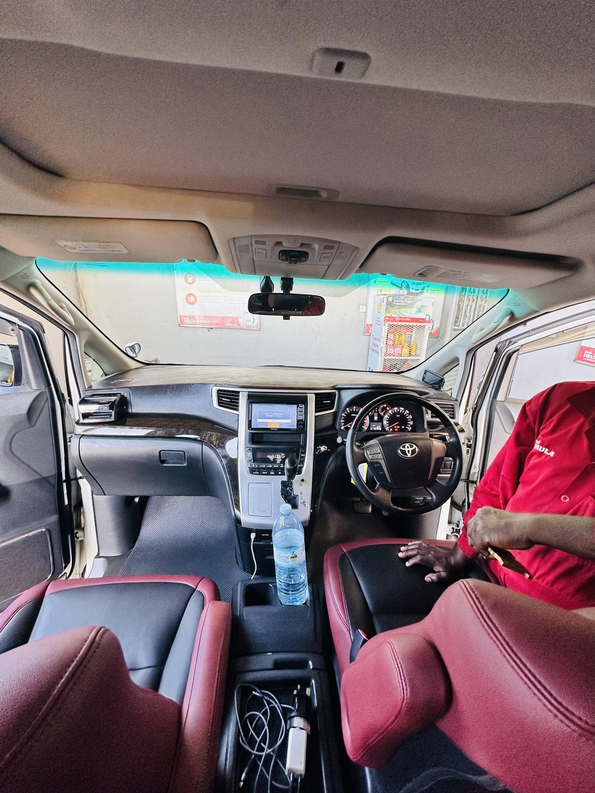 Makanga Auto Centre technician preparing to service a customer's Toyota Alphard